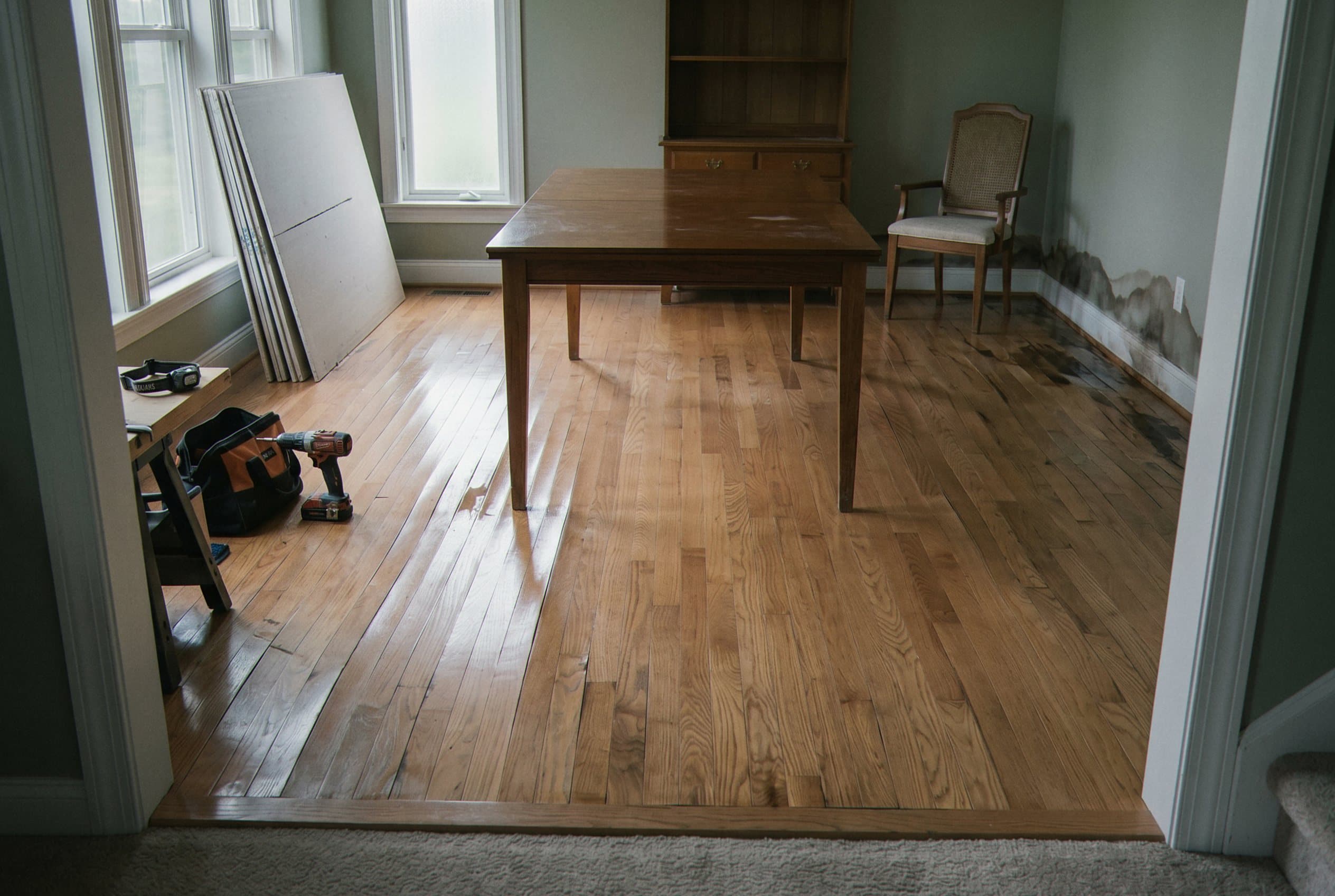 Warped hardwood flooring from water saturation