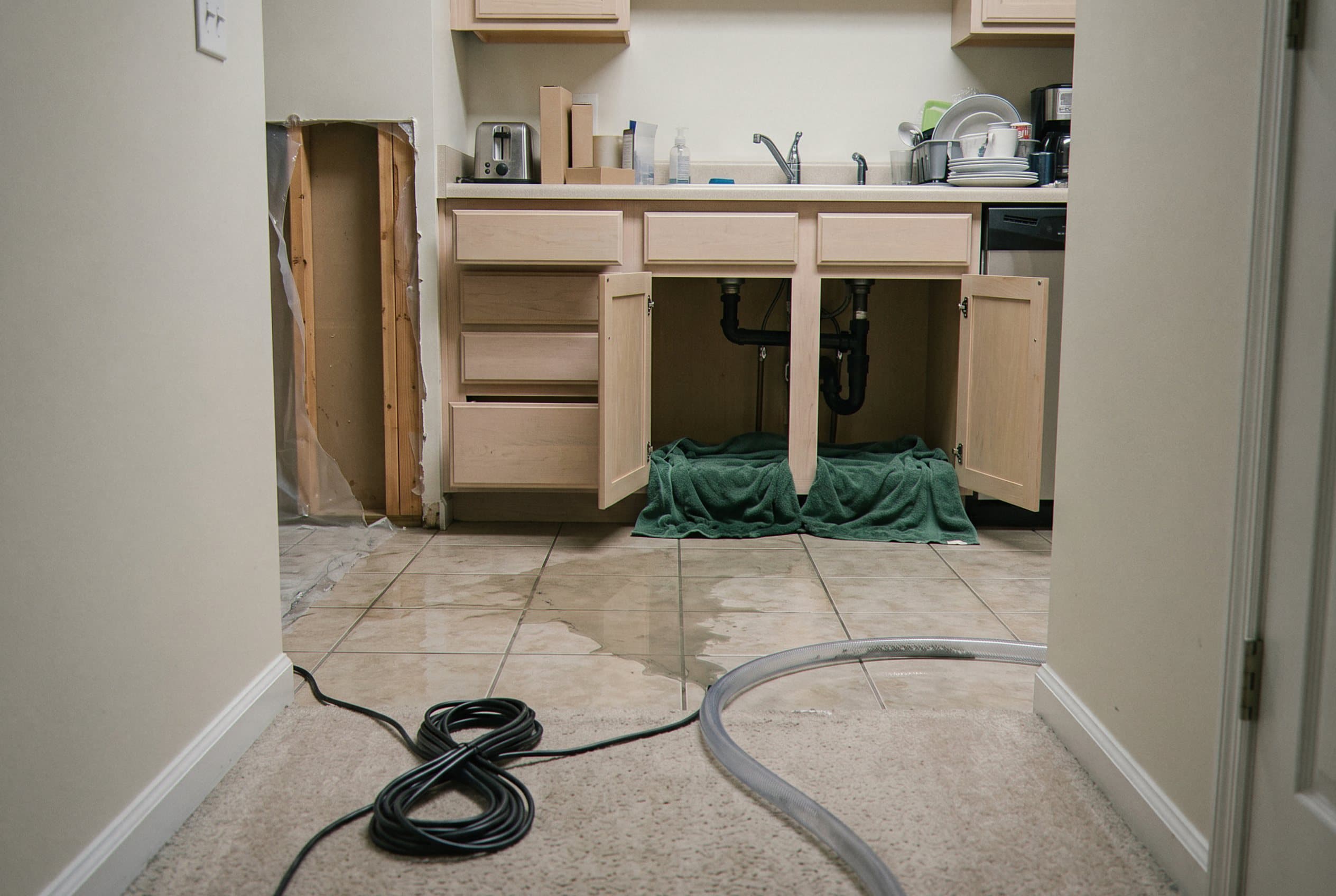 Water damage in kitchen from burst pipe