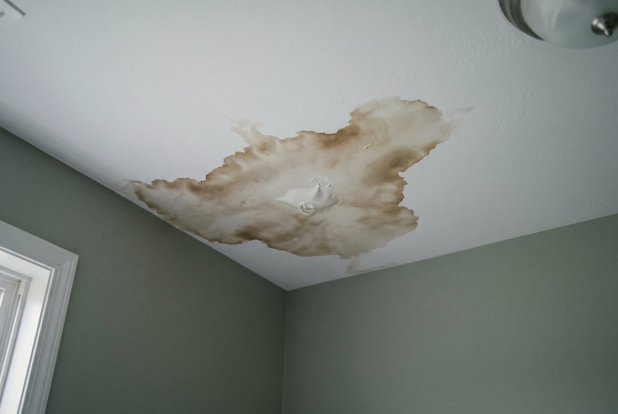 Hidden leak staining ceiling drywall slowly